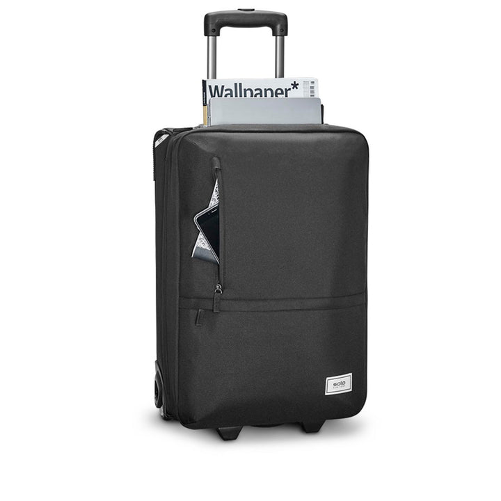 front view of Solo Re:treat Carry-on in black loaded with accessories