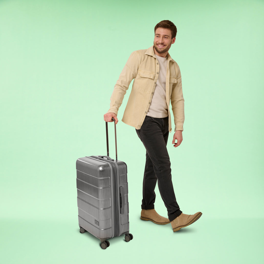 model using Solo Re:serve Check-In Spinner suitcase