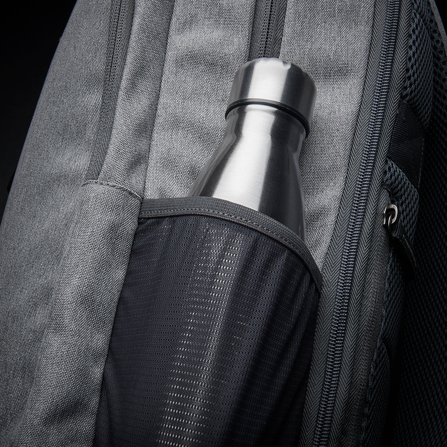 side view showing how a water bottle is stored in Solo Re:define backpack