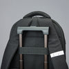 Solo Re:define backpack in black attached to suitcase handle
