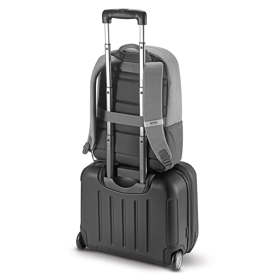 grey Solo Re:cover Backpack attached to luggage handle 