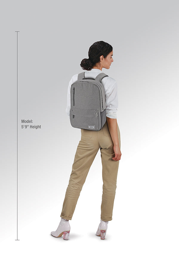 model wearing grey Solo Re:cover Backpack