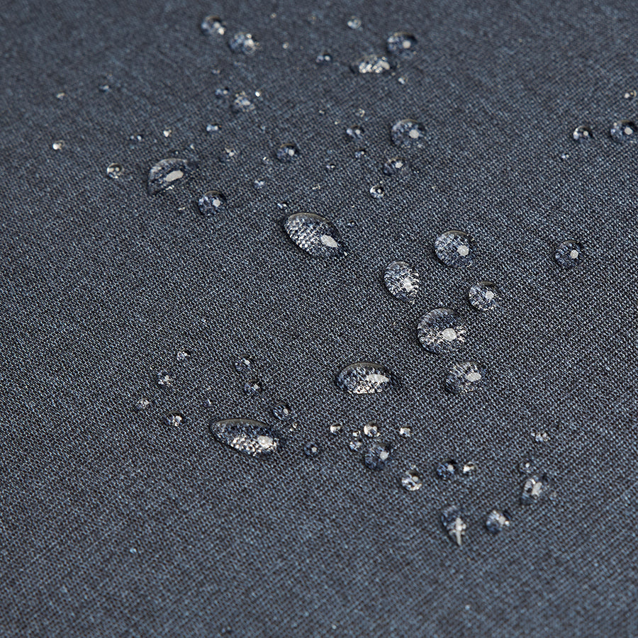 water beading off material used to construct Solo Re:cover Backpack in navy