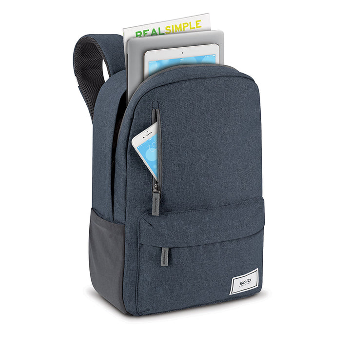 view of Solo Re:cover backpack in navy loaded with supplies