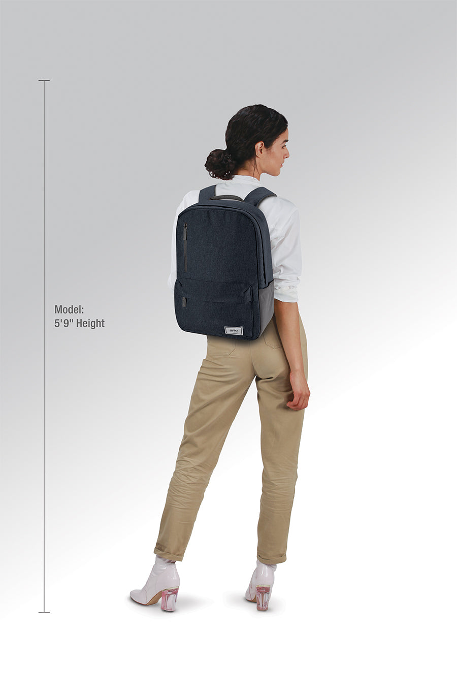 model wearing Solo Re:cover Backpack in navy