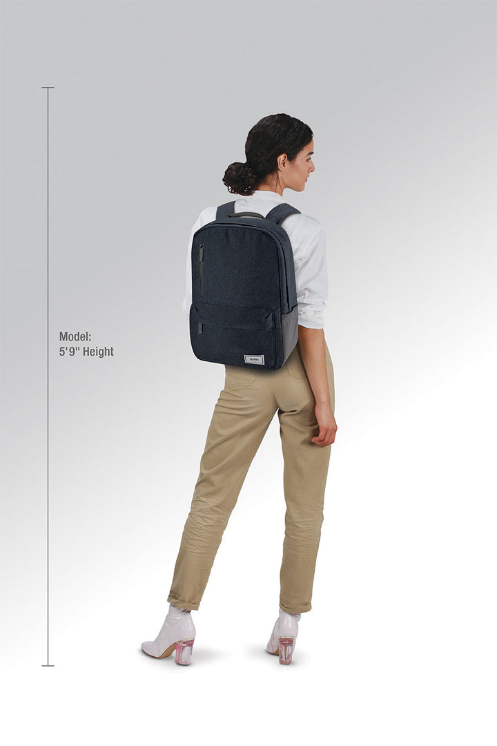 model wearing Solo Re:cover Backpack in navy
