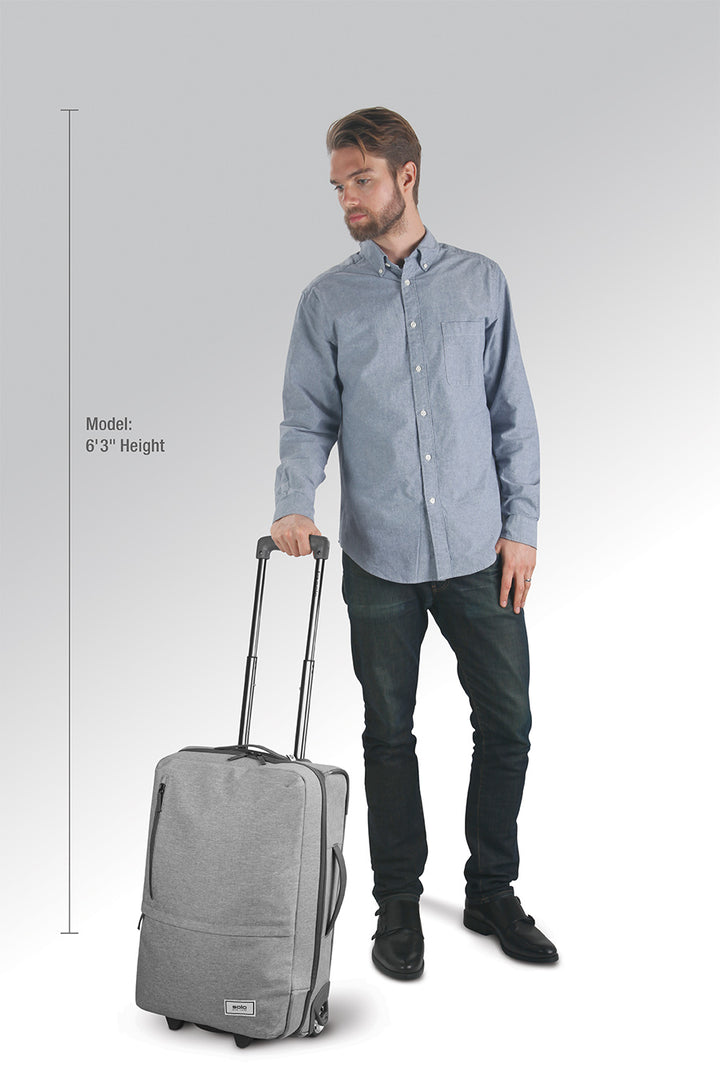 model showcasing grey Solo Re:treat carry-on