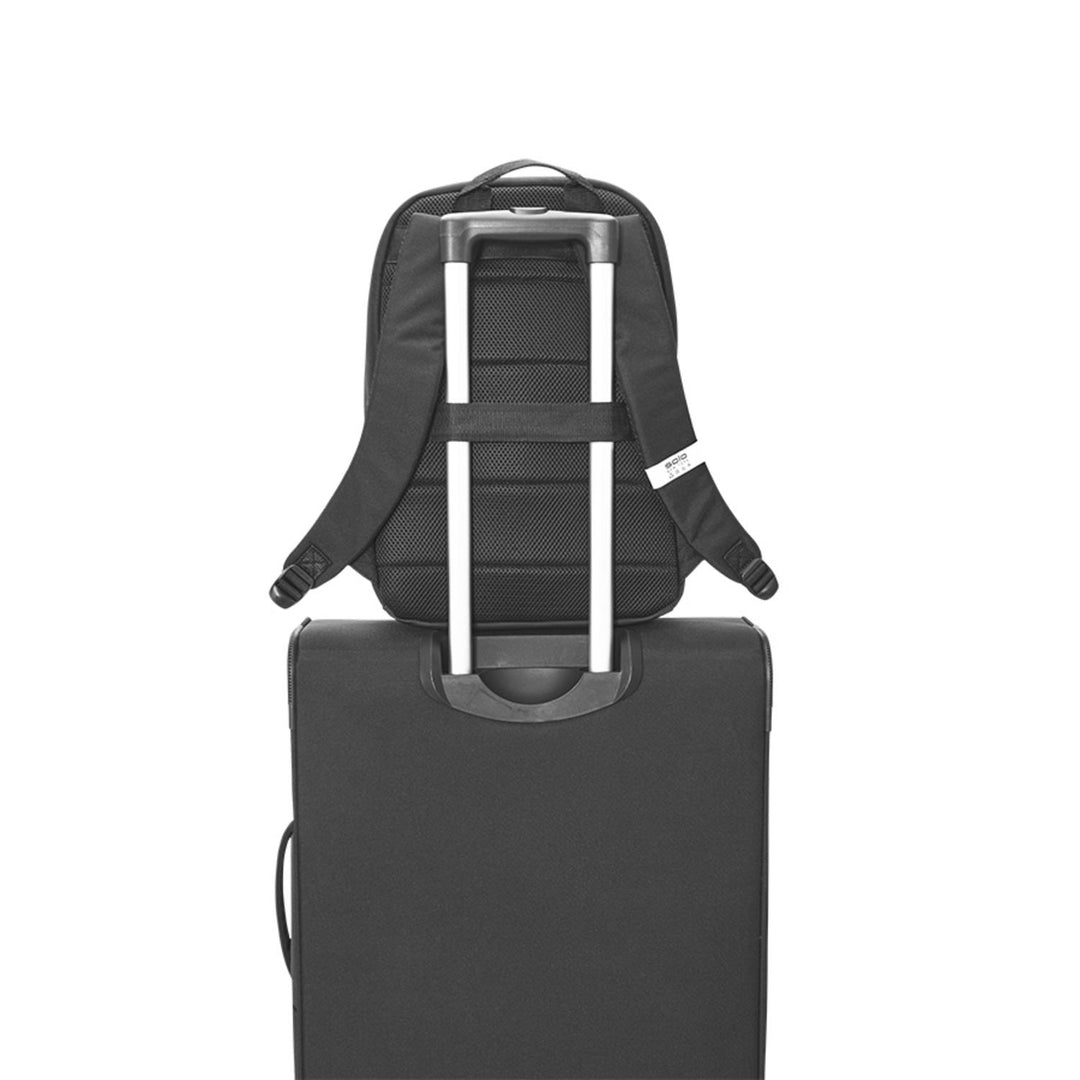 Solo Re:treat Check-in Spinner Suitcase with black Solo backpack attached to telescoping handle